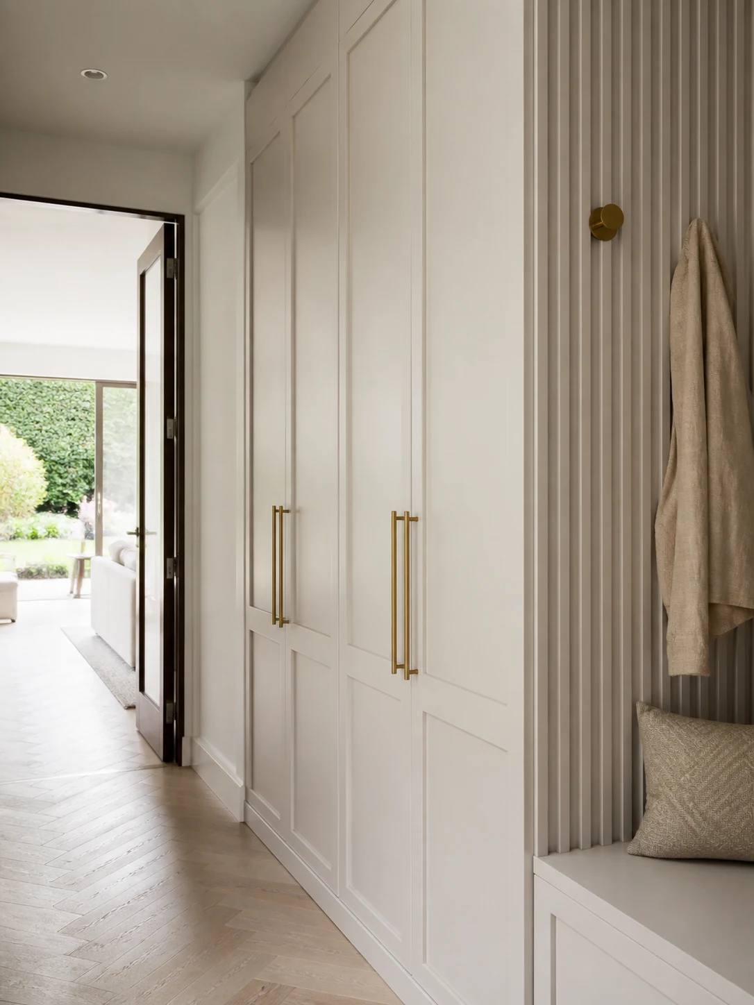 Painted fibreboard hallway cabinetry with crisp routed doors and fluted panels