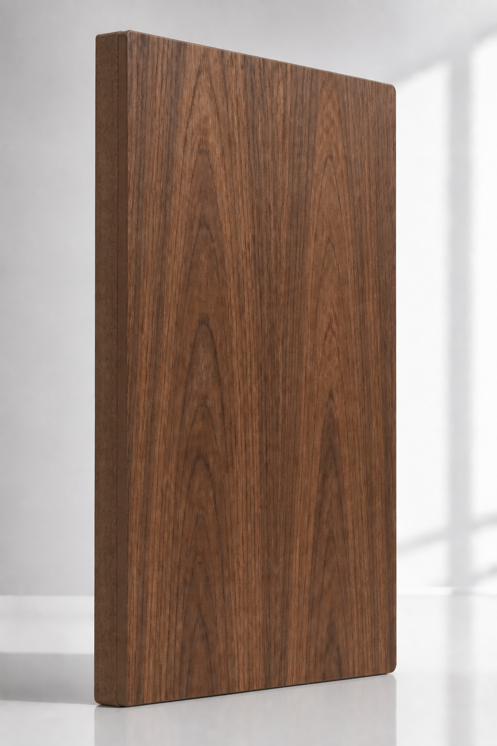 Substantial warm walnut veneer panel with a fully blended continuous edge