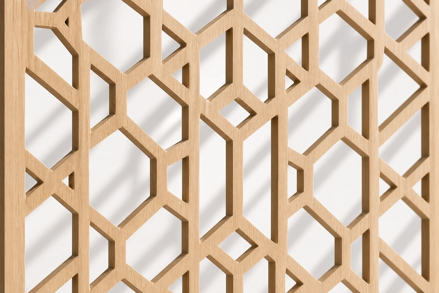 Close-up of a pale oak CNC screen with structured geometric cutouts