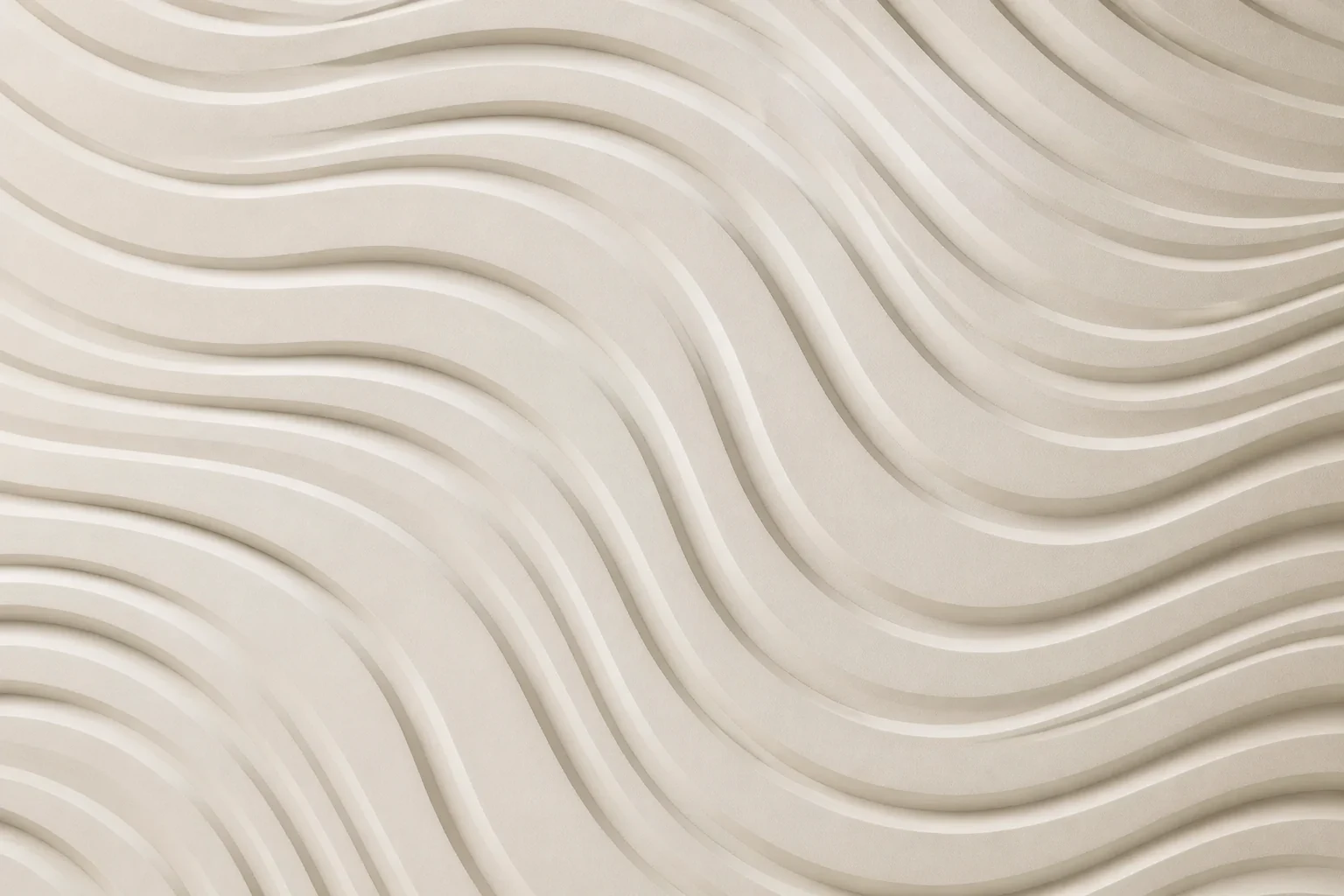Close-up of an ivory CNC panel with flowing wave relief