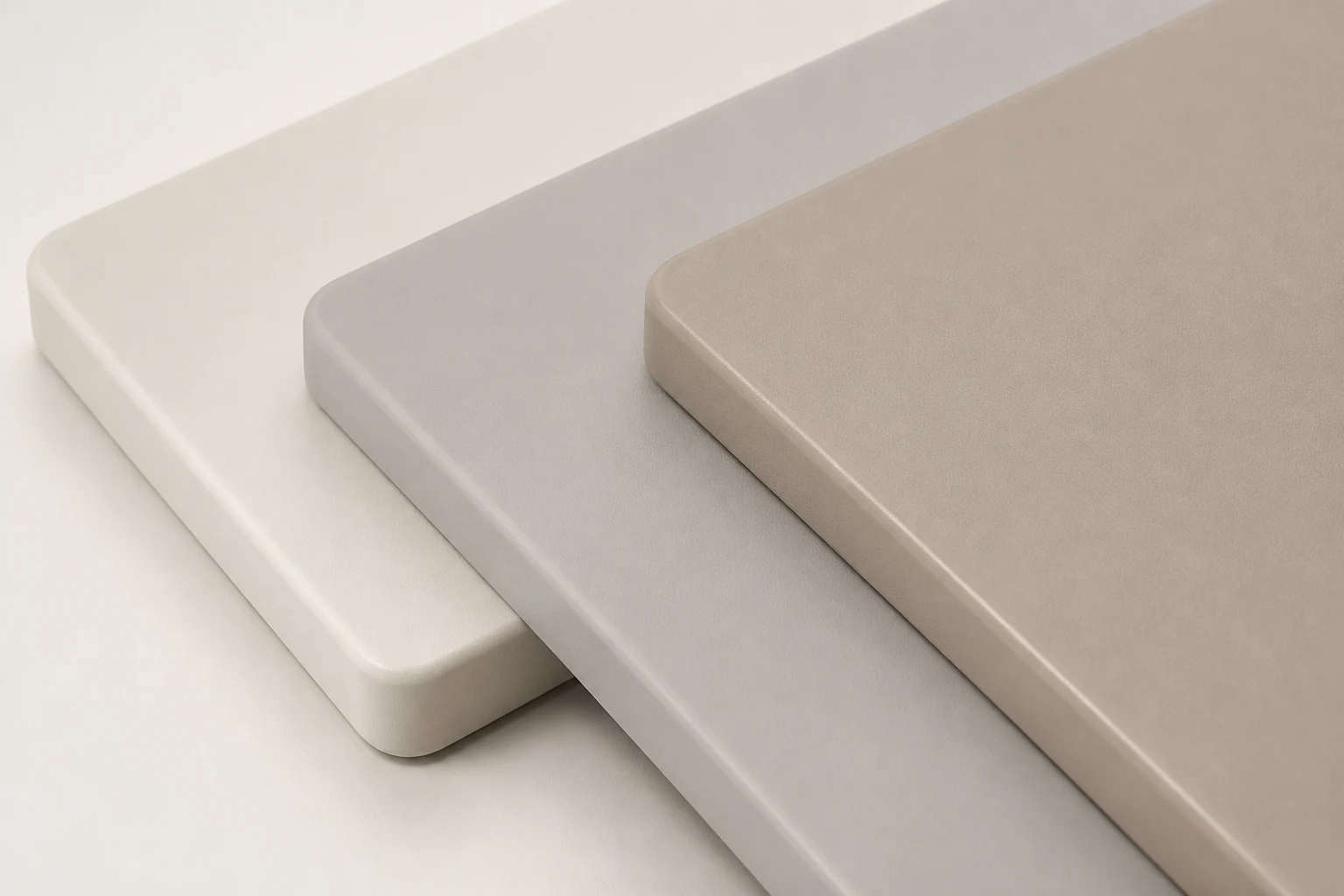 Layered matte spray panel samples in warm white, grey and taupe